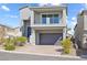 Charming two-story home with a well-manicured front yard and a convenient two-car garage at 10830 Space Odyssey Ave, Las Vegas, NV 89129