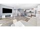 Bright, open-concept living area with a modern fireplace and beautiful plank floors at 10830 Space Odyssey Ave, Las Vegas, NV 89129