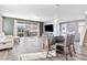 Open-concept living space with a balcony, dining area, and comfortable seating at 10830 Space Odyssey Ave, Las Vegas, NV 89129