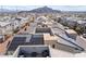 This aerial shot features a rooftop terrace with comfortable seating, solar panels, and views of the surrounding neighborhood at 10830 Space Odyssey Ave, Las Vegas, NV 89129