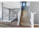 Beautifully carpeted staircase and railing, complemented by stunning wood-look floors at 10830 Space Odyssey Ave, Las Vegas, NV 89129