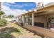 Relaxing covered patio area in a spacious backyard with ample seating and views of the well-maintained lawn at 1133 Mount Olympias Ct, Las Vegas, NV 89110