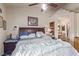 Spacious bedroom featuring ceiling fan, wood floors, and a cozy atmosphere at 1133 Mount Olympias Ct, Las Vegas, NV 89110