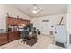 Office features tile floors, custom cabinetry, and a large desk workspace at 1133 Mount Olympias Ct, Las Vegas, NV 89110