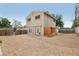 Expansive backyard with potential for landscaping, featuring double doors to the home at 1200 I Ave, Boulder City, NV 89005