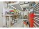 Well-lit basement featuring a large workbench, ideal for hobbies and storage at 1200 I Ave, Boulder City, NV 89005
