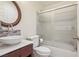 Bathroom with a vessel sink, round mirror, stylish fixtures, and shower with sliding glass door at 1200 I Ave, Boulder City, NV 89005