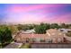 Charming single-story home with a well-maintained yard, a fenced backyard and an American flag at 1200 I Ave, Boulder City, NV 89005