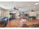Living room with a pool table, media center, comfortable seating, and hardwood flooring at 1200 I Ave, Boulder City, NV 89005