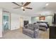 Main bedroom features neutral colors, a ceiling fan, and a comfortable seating area at 1200 I Ave, Boulder City, NV 89005