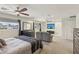 Bright and spacious primary bedroom with ceiling fans, large windows, and ample closet space at 1200 I Ave, Boulder City, NV 89005
