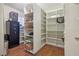 Walk-in pantry featuring ample shelving and a sturdy safe for security at 1200 I Ave, Boulder City, NV 89005