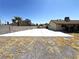 A large backyard area with a spacious concrete patio, suitable for various outdoor activities at 1208 Winwood St, Las Vegas, NV 89108