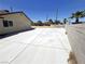 Spacious backyard area with a large concrete patio, perfect for outdoor entertaining at 1208 Winwood St, Las Vegas, NV 89108