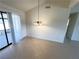 Dining room with tile floors and a modern light fixture, perfect for Gathering meals at 1208 Winwood St, Las Vegas, NV 89108