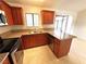 Beautiful kitchen with wood cabinets, granite countertops, and stainless steel appliances at 1208 Winwood St, Las Vegas, NV 89108