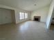 Spacious living room featuring tile flooring, a fireplace, and ample natural light at 1208 Winwood St, Las Vegas, NV 89108
