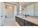 This bathroom features modern fixtures, white countertops, and a tub with shower at 138 Crimson Cactus Ave, Henderson, NV 89011