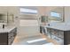 This elegant bathroom features double sinks, ample storage, and modern fixtures and hardware at 138 Crimson Cactus Ave, Henderson, NV 89011