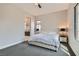 Comfortable bedroom features soft carpet, neutral walls, and an ensuite bathroom entrance at 138 Crimson Cactus Ave, Henderson, NV 89011