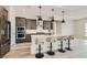 Kitchen featuring an island with seating, modern appliances, and plenty of counter space at 138 Crimson Cactus Ave, Henderson, NV 89011