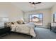 A bright main bedroom features a large window with mountain views, comfortable carpet and neutral décor at 138 Crimson Cactus Ave, Henderson, NV 89011
