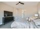 The stylish main bedroom offers plush bedding, dark wood furniture, neutral walls and plenty of space at 138 Crimson Cactus Ave, Henderson, NV 89011