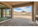 Covered outdoor patio provides views of mountains in distance and adjacent lot at 138 Crimson Cactus Ave, Henderson, NV 89011