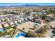 Aerial view showcasing swimming pools in backyard and a property on a large lot in a residential neighborhood at 1410 E Serene Ave, Las Vegas, NV 89123