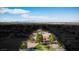 Expansive aerial view of the property showcasing its large lot size, mature trees, and scenic city views at 1410 E Serene Ave, Las Vegas, NV 89123