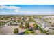 Expansive aerial view of the property showcasing its large lot size, mature trees, and scenic city views at 1410 E Serene Ave, Las Vegas, NV 89123