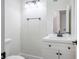 Neat half-bathroom with dark hardware, a new vanity, and a white sink at 1410 E Serene Ave, Las Vegas, NV 89123