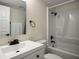 Bright bathroom with a shower-tub combination and modern fixtures at 1410 E Serene Ave, Las Vegas, NV 89123