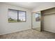 Bedroom featuring plush carpet and a closet with mirrored doors at 1410 E Serene Ave, Las Vegas, NV 89123