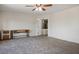 Bedroom featuring plush carpet, a modern ceiling fan, and a neutral color palette at 1410 E Serene Ave, Las Vegas, NV 89123