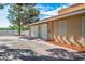 View of the three-car garage on an estate home, featuring a driveway and side yard at 1410 E Serene Ave, Las Vegas, NV 89123
