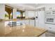 Modern kitchen featuring granite countertops, stainless steel appliances, and bright natural lighting at 1410 E Serene Ave, Las Vegas, NV 89123