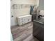 Well-organized laundry area with white cabinets, countertops, and modern appliances at 1410 E Serene Ave, Las Vegas, NV 89123