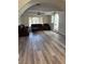 Spacious living room with hardwood floors, ceiling fan, and abundant natural light at 1410 E Serene Ave, Las Vegas, NV 89123