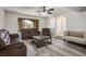 Living room showcasing hardwood floors, neutral walls, and comfortable seating at 1410 E Serene Ave, Las Vegas, NV 89123