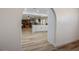 Open-concept living space with wood-look floors and an archway leading to another room at 1410 E Serene Ave, Las Vegas, NV 89123