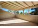 Covered patio with stucco walls and plenty of natural light at 1410 E Serene Ave, Las Vegas, NV 89123
