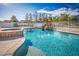 Sparkling pool with rock waterfall feature in a beautifully landscaped backyard at 1410 E Serene Ave, Las Vegas, NV 89123