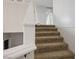 Clean, carpeted staircase with white railings ascending to the upper level at 1410 E Serene Ave, Las Vegas, NV 89123