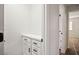 Small storage closet features built-in cabinets and adjoins bedroom at 1410 E Serene Ave, Las Vegas, NV 89123