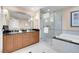 This bathroom offers dual sinks, a glass-enclosed shower, and a large soaking tub at 145 E Harmon Ave # 2411, Las Vegas, NV 89109