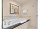 Modern bathroom featuring a soaking tub with black granite countertop and stylish fixtures and neutral decor at 145 E Harmon Ave # 2411, Las Vegas, NV 89109