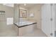 Bathroom featuring a shower, soaking tub, white door, white tiles, and neutral wall color at 145 E Harmon Ave # 2411, Las Vegas, NV 89109