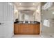 The bathroom features a double vanity, a shower enclosed in glass, and neutral colors at 145 E Harmon Ave # 2411, Las Vegas, NV 89109