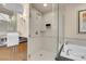 A luxurious bathroom offering a walk-in shower with a glass door, and granite vanity top with chrome fixtures at 145 E Harmon Ave # 2411, Las Vegas, NV 89109